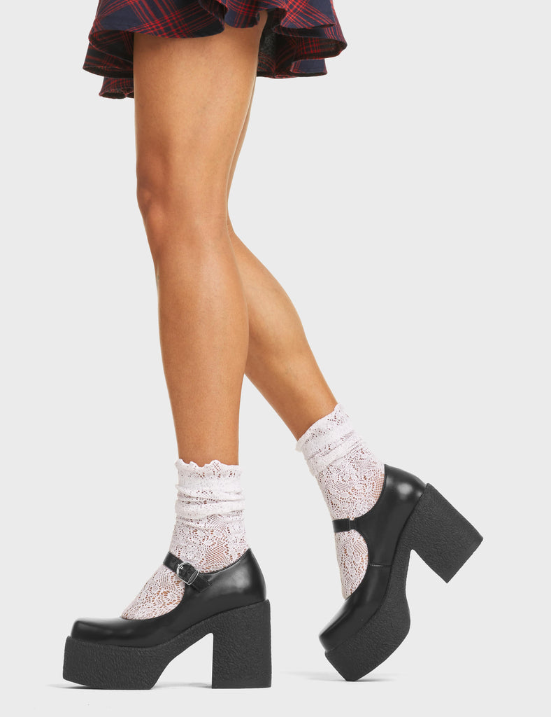 Genius Chunky Mary Jane Shoes, in Black Faux Leather. These vegan shoes feature an adjustable strap with a silver 'D'-shaped buckle on a platform rubber sole. Made with eco-friendly materials and 100% cruelty-free!&nbsp;