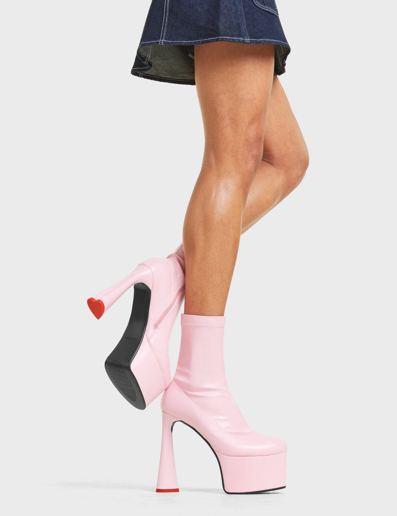 CAN'T STOP

Addicted Platform Ankle Boots in Pink stretch faux leather. These platform boots feature on our platform sole in additon to a heart shaped heel with a red heart at the bottom. reach new heights in your fashion game. Made with eco-friendly materials and 100% cruelty-free, these platform boots are as ethical as they are on point.

- Platform Height
- Heel Height
- Zipper
- Stretchy Material
- Ankle Length
- Platform sole
- Heart Heel
- Heart Detail
- 100% vegan

SKU: LMF 4467 - PinkStretchPU