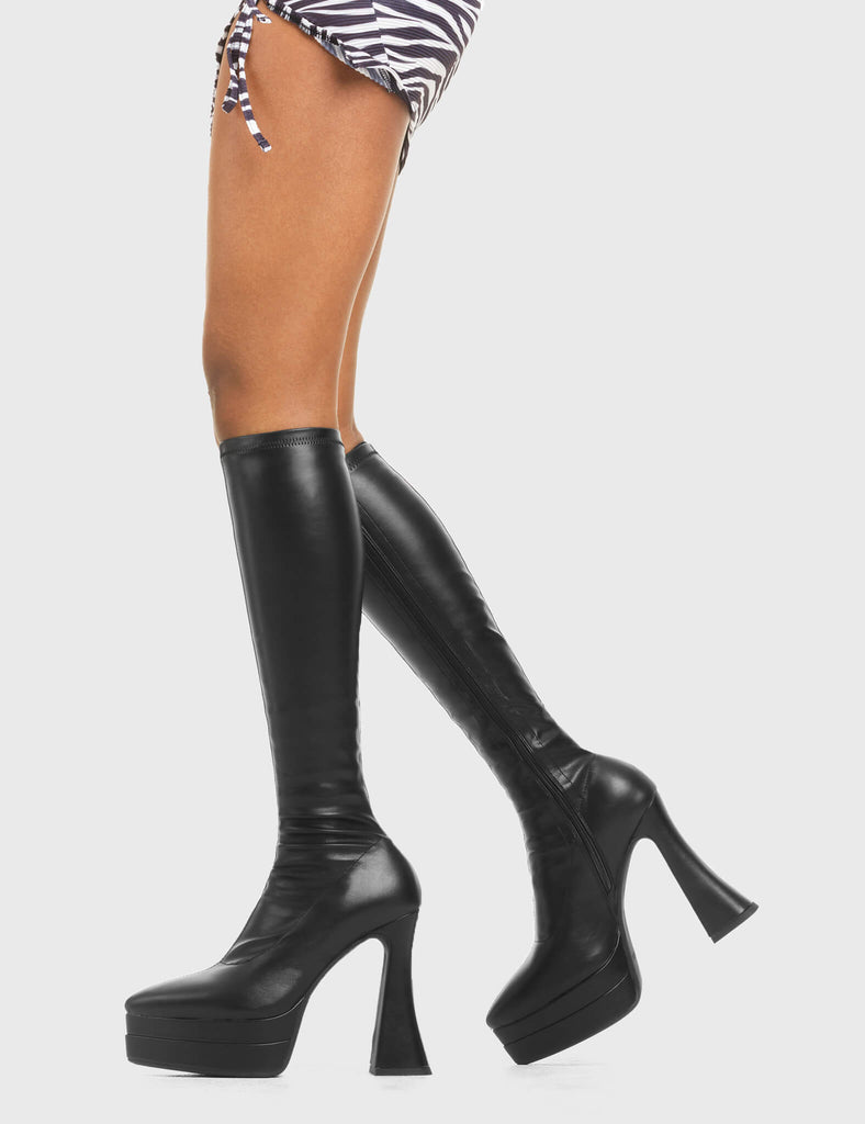 THESE BOOTS ARE MAKE FOR WALKING
  
  Alter Ego Platform Knee High Boots in Black fitted faux leather. These platform boots feature a minimalist look with a flared heel. Made with eco-friendly materials and 100% cruelty-free, these platform boots are as ethical as they are chic.
  
  - Platform Height
  - Fitted feel
  - Flared heel
  - Pointed toe
  - High Heel
  - 100% vegan 
  
  SKU: LMF 3532 - BlackPUStretch