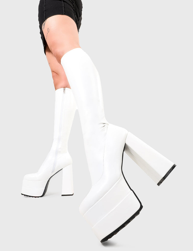 TIKTOK made me buy it!
 
 Bad Gurl Wide Calf Platform Knee High Boots in White Stretch faux leather. These platform boots feature on our double stack platform sole, stepping up and standing tall. Made with eco-friendly materials and 100% cruelty-free, these platform boots are as ethical as they are Legendary!
 
 - Platform Height
 - Heel Height
 - White Zip 
 - Wid Fit
 - Knee high length
 - Shark's teeth grip
 - Chunky Platform sole
 - Round Toe 
 - 100% vegan 
 
 SKU: LMF 2696 - WhitePU - WIDE FIT
