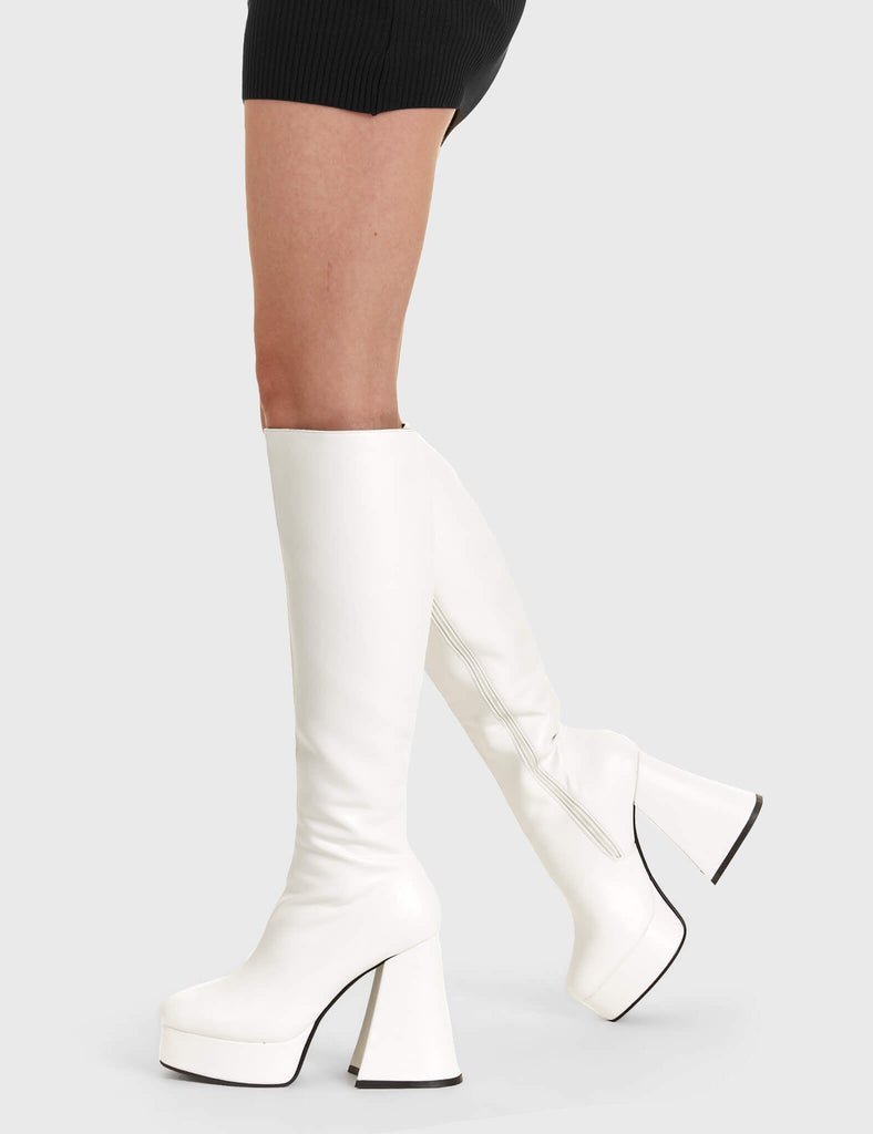 Stylish Uplifts.
  
  Black Swan Platform Knee High Boots in White faux leather. These white vegan Platform Boots feature on our platform sole, elevating your style and making a lasting impression. Made with eco-friendly materials and 100% cruelty-free, these platform boots are as ethical as they are stylish!
  
  
  - Platform Height: 2.6 inch
  - Heel Height: 5.5 inch
  - White zipper 
  - Chunky Platform sole
  - Flared heel
  - Round Toe
  - 100% vegan 
  
  SKU: LMF 1806 - WhitePU