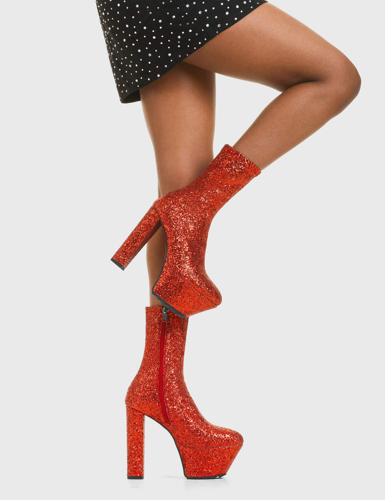 TIME TO PARTY
  
  Bling Platform Ankle Boots in Red Glitter. These vegan western Boots feature a glittery look, perfect for a night out. Made with eco-friendly materials and 100% cruelty-free, these boots are as ethical as they are Eye-Catching!
  
  
  - Platformed high heel
  - Calf length
  - Red Glitter
  - Shark teeth Grip
  - Rounded toe 
  - 100% vegan 
  
  SKU: LMF 3819 - RedGlitter