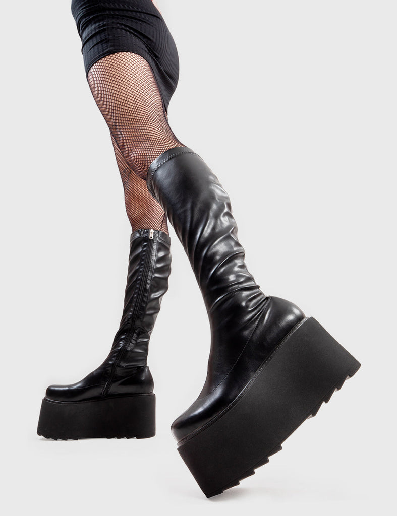 Step Out in Fashion
  
  FYI Chunky Platform Knee High Boots in Black faux leather. These flatform shoes feature a minimalist design, with a fitted feel. Made with eco-friendly materials and 100% cruelty-free, these platform boots are as ethical as they are Edgy
  
  - Platform Height
  - fitted feel
  - Flatform Sole
  - Shark's Teeth Grip
  - 100% vegan 
  
  SKU: LMF 3147 - BlackPU
