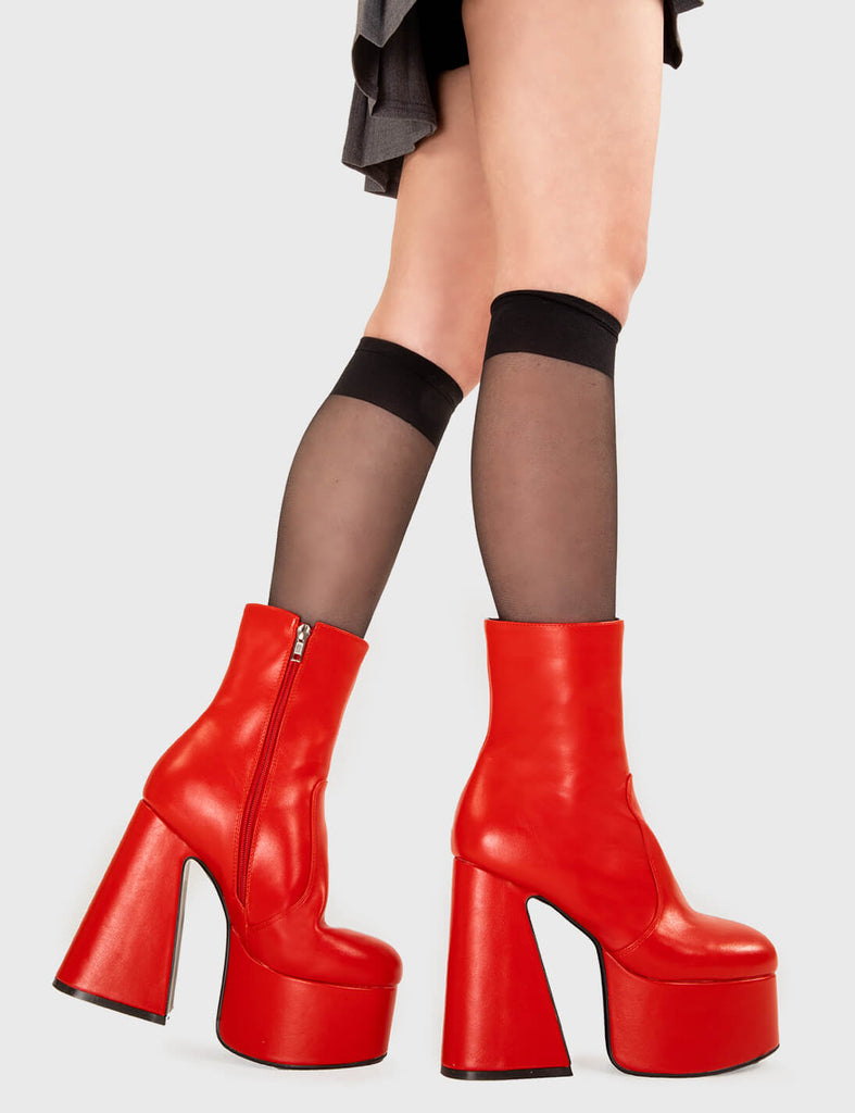 SMOOTH LIKE BUTTER
  
  Under Cover Platform Ankle Boots in Red faux leather. These platform boots feature a minimalist look with a flared heel, keeping it nice and classy. Made with eco-friendly materials and 100% cruelty-free, these platform boots are as ethical as they are chic.
  
  - Platform Height
  - Ankle length
  - Flared heel
  - High Heel
  - 100% vegan 
  
  SKU: LMF 3349 - RedPU
