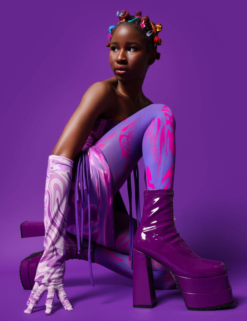 Runway Ready
  
  Cassette Platform Ankle Boots in Purple Patent faux leather. These purple vegan Platform boots feature on our double stack platform sole, sleek and stylish to own your runway! Made with eco-friendly materials and 100% cruelty-free, these platform boots are as ethical as they are runway worthy!
  
  
  - Platform Height: 2.2 inch
  - Heel Height: 5.5 inch 
  - Purple Zipper 
  - Shark's teeth rubber grip 
  - Chunky platform sole
  - Square Toe
  - 100% vegan 
  
  SKU: LMF 2141 - PurplePAT
