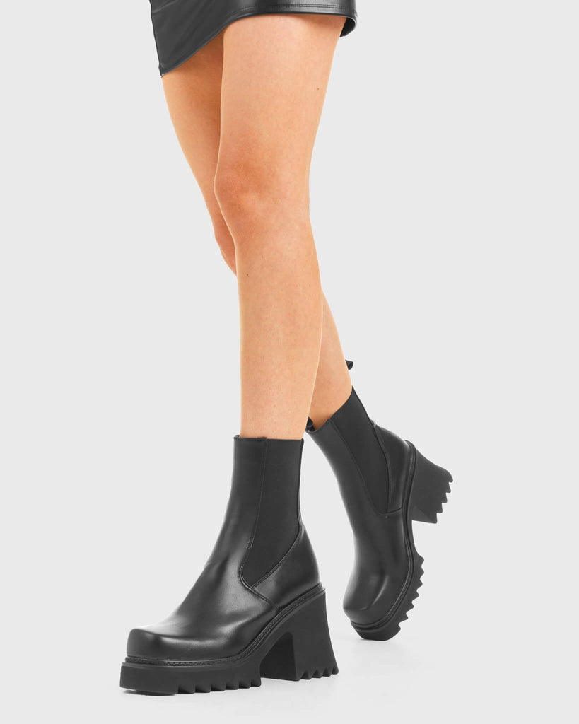 THESE BOOTS ARE MADE FOR WALKING
  
  Elevate Chunky Platform Ankle Boots in Black faux leather. These vegan western Boots feature a black gusset and a shark teeth grip sole, very chic. Made with eco-friendly materials and 100% cruelty-free, these boots are as ethical as they are edgy!
  
  
  - Chunky Platform
  - Calf length
  - Shark teeth grip
  - Black gusset
  - Rounded toe 
  - 100% vegan 
  
  SKU: LMF 3728 - BlackPU