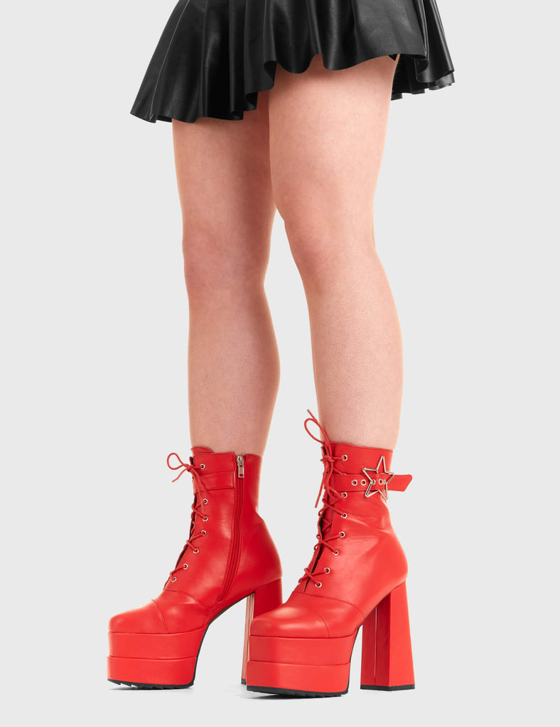 STAR GAZING 
  
  Famous Friend Platform Ankle Boots in Red faux leather. These platform boots feature a silver star buckle with an adjustable strap, keeping it nice and classy. Made with eco-friendly materials and 100% cruelty-free, these platform boots are as ethical as they are chic.
  
  - Platform Height
  - Silver Star buckles
  - Adjustable straps
  - Lace up
  - Shark teeth grip
  - High Heel
  - 100% vegan 
  
  SKU: LMF 3319 - RedPU