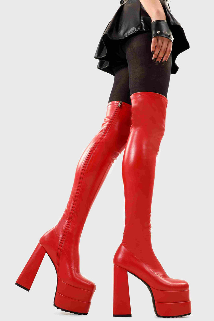 Ground Breaking
  
  Fantasies Platform Thigh High Boots in Red Stretch faux leather. These platform boots feature on our double stack platform sole, leave them with a lasting impression. Made with eco-friendly materials and 100% cruelty-free, these platform boots are as ethical as they are Ground Breaking!
  
  - Platform Height
  - Heel Height
  - Red Zip 
  - Thigh high length
  - Shark's teeth grip
  - Chunky Platform sole
  - Round Toe 
  - 100% vegan 
  
  SKU: LMF 2698 - RedPU