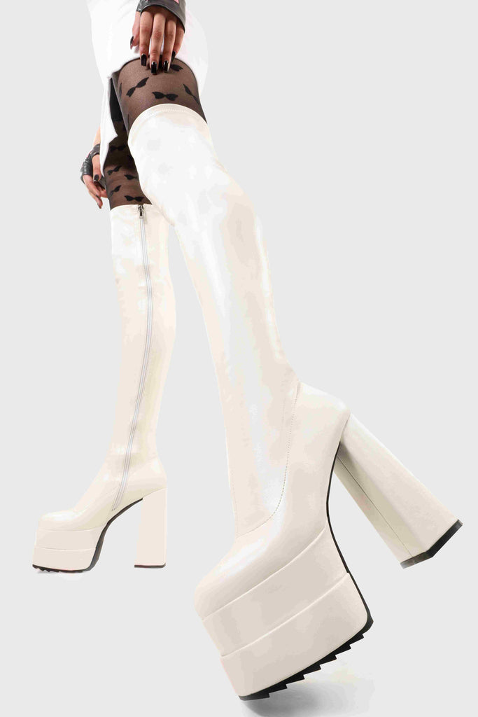 Ground Breaking
  
  Fantasies Platform Thigh High Boots in White Stretch faux leather. These platform boots feature on our double stack platform sole, leave them with a lasting impression. Made with eco-friendly materials and 100% cruelty-free, these platform boots are as ethical as they are Ground Breaking!
  
  - Platform Height
  - Heel Height
  - White Zip 
  - Thigh high length
  - Shark's teeth grip
  - Chunky Platform sole
  - Round Toe 
  - 100% vegan 
  
  SKU: LMF 2698 - WhitePU