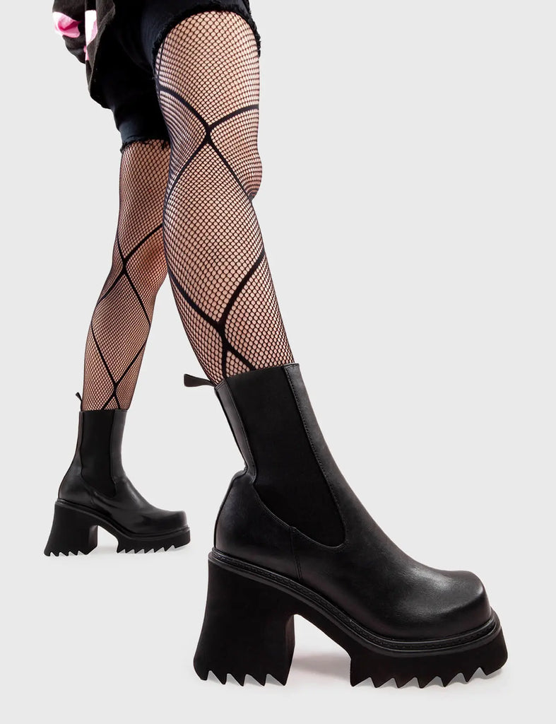 Anything But Basic
  
  Fireflies Chunky Platform Ankle Boots in Black faux leather. These platform boots feature an elegant, minimalist design, with an elastic gusset and a chunky sole, the perfect way to elevate any outfit. Made with eco-friendly materials and 100% cruelty-free, these platform boots are as ethical as they are cool.
  
  - Platform Height
  - Heel Height 
  - Elastic gusset
  - Black Zip
  - Shark's teeth grip
  - Chunky Platform sole
  - 100% vegan 
  
  SKU: LMF 2911 - BlackPU