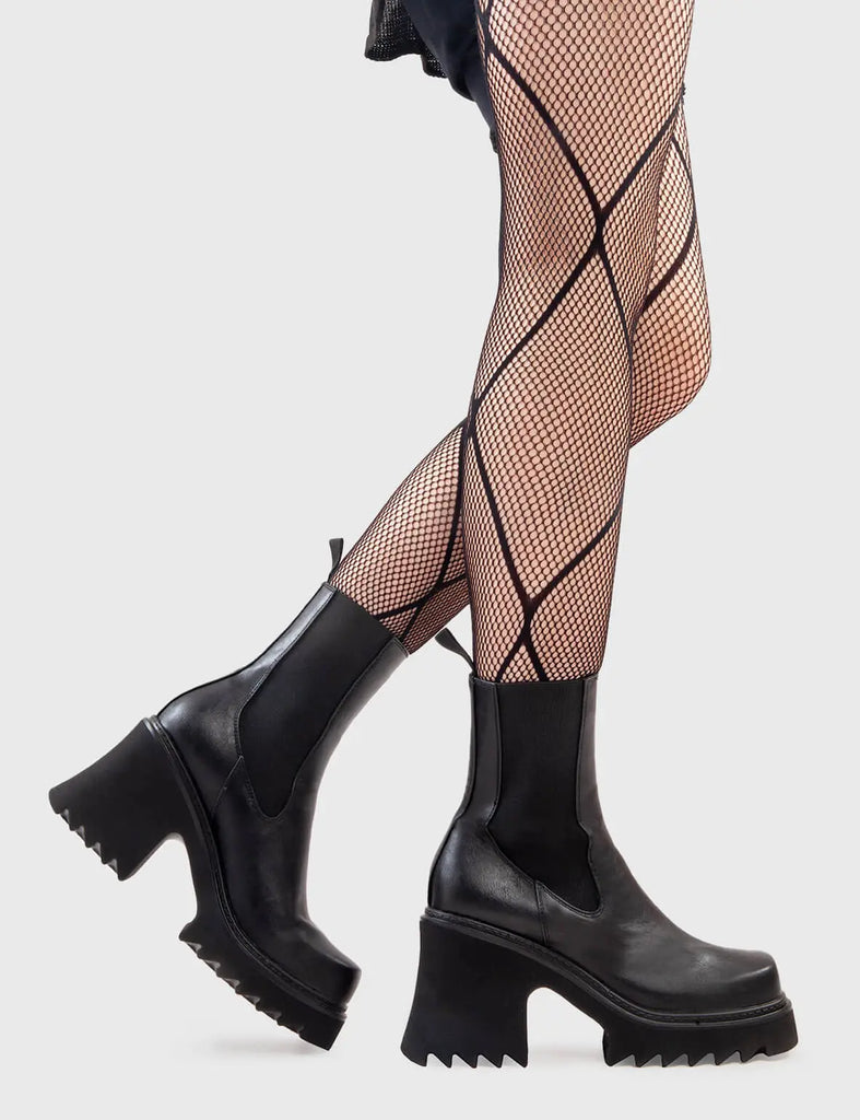 Anything But Basic
  
  Fireflies Chunky Platform Ankle Boots in Black faux leather. These platform boots feature an elegant, minimalist design, with an elastic gusset and a chunky sole, the perfect way to elevate any outfit. Made with eco-friendly materials and 100% cruelty-free, these platform boots are as ethical as they are cool.
  
  - Platform Height
  - Heel Height 
  - Elastic gusset
  - Black Zip
  - Shark's teeth grip
  - Chunky Platform sole
  - 100% vegan 
  
  SKU: LMF 2911 - BlackPU