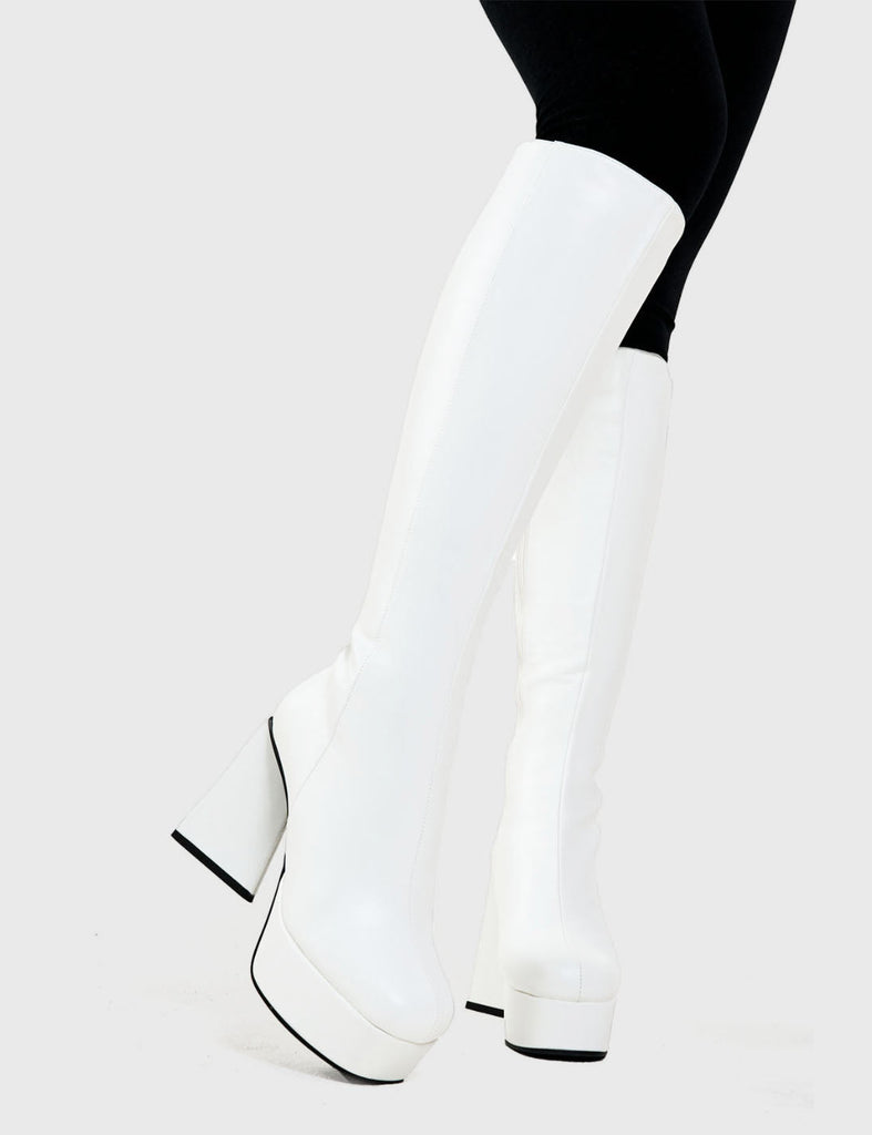 NICE AND SLEEK 
  
  Keepin' It Classy Platform Knee High Boots in White faux leather. These platform boots feature a minimalist look with a triangle heel. Made with eco-friendly materials and 100% cruelty-free, these platform boots are as ethical as they are chic.
  
  - Platform Height
  - Knee highlength
  - Triangle heel
  - High Heel
  - 100% vegan 
  
  SKU: LMF 3340 - WhitePU