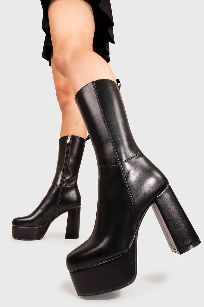 THE TIMELESS ONE

Going Under Wide Fit Platform Calf Boots in Black faux leather. These Black vegan Boots feature an elegant, minimalist design and a Platform sole and heel, perfect for adding height and style to any outfit. Made with eco-friendly materials and 100% cruelty-free, these boots are as ethical as they are stylish.


- Platform Height: 1.25 inch
- Heel Height: 4.2 inch
- Calf High length
- Wide Fit 
- Black zipper 
- Platform sole
- Round toe 
- 100% vegan 

SKU: LMF 1209 - BlackPU - WIDE FIT