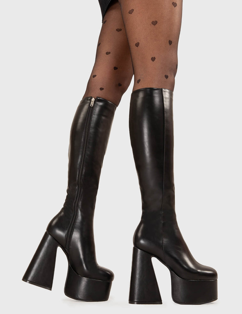 NICE AND SMOOTH
  
  Hate You Platform Knee High Boots in Black faux leather. These platform boots feature a minimalist look with a Flared heel, keeping it nice and classy. Made with eco-friendly materials and 100% cruelty-free, these platform boots are as ethical as they are chic.
  
  - Platform Height
  - Knee high 
  - Flared heel
  - High Heel
  - 100% vegan 
  
  SKU: LMF 3355 - BlackPU