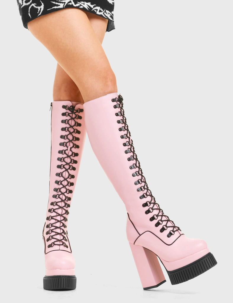 HIGH IN THE SKY
  
  Hidden Agenda Creeper Platform Knee High Boots in Pink faux leather. These vegan western Boots feature a lace up design and Black stitch detailing. Made with eco-friendly materials and 100% cruelty-free, these boots are as ethical as they are trendy!
  
  
  - Heel Height 
  - Knee high length
  - Black stitching
  - Black zip 
  - Rubber grip sole
  - Rounded toe 
  - 100% vegan 
  
  SKU: LMF 3968 - PinkPU