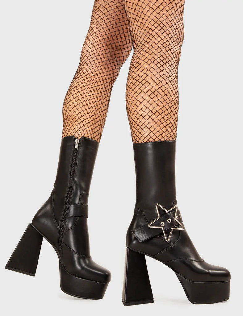STAR IN THE SKY 
  
  Hound Dog Platform Ankle Boots in Black faux leather. These platform boots feature a sliver star buckle with an adjustable strap, keeping it nice and edgy. Made with eco-friendly materials and 100% cruelty-free, these platform boots are as ethical as they are chic.
  
  - Platform Height
  - Silver Star buckles
  - Calf length
  - Adjustable straps
  - Triangle heel
  - High Heel
  - 100% vegan 
  
  SKU: LMF 3336 - BlackPU