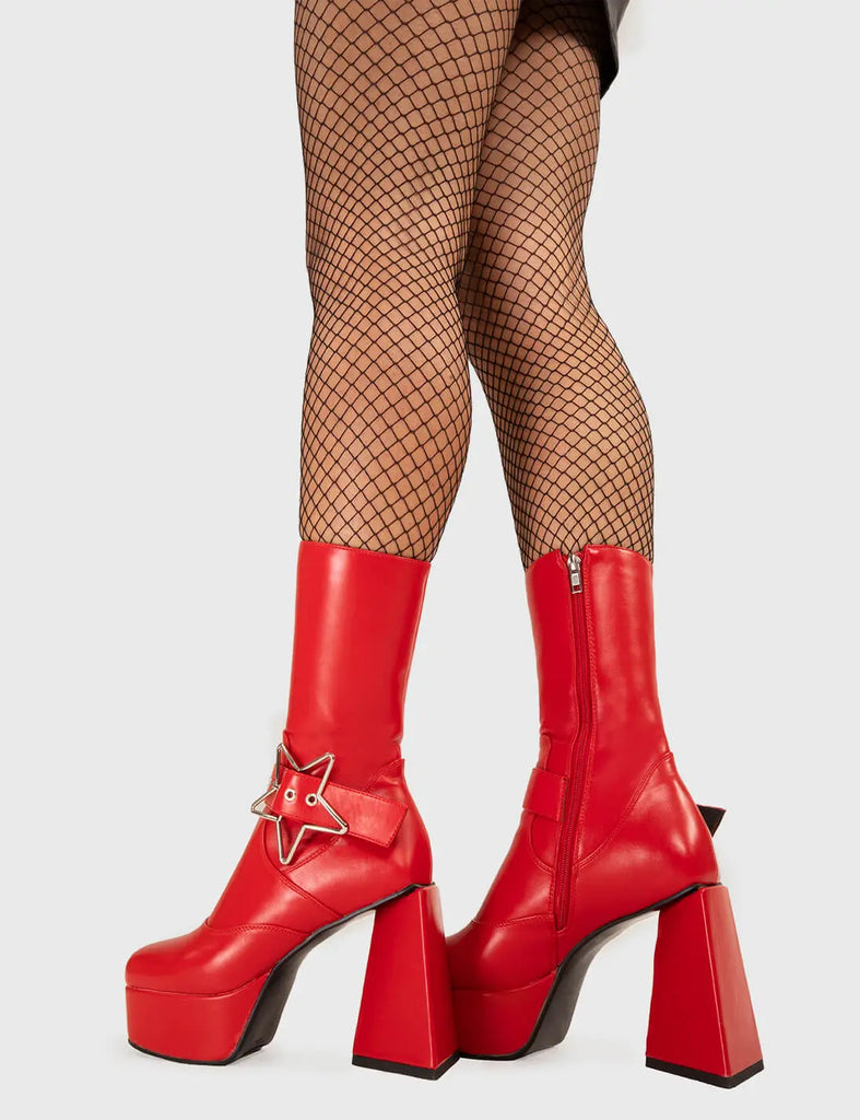 STAR IN THE SKY 
  
  Hound Dog Platform Ankle Boots in Black faux leather. These platform boots feature a silver star buckle with an adjustable strap, keeping it nice and edgy. Made with eco-friendly materials and 100% cruelty-free, these platform boots are as ethical as they are chic.
  
  - Platform Height
  - Silver Star buckles
  - Calf length
  - Adjustable straps
  - Triangle heel
  - High Heel
  - 100% vegan 
  
  SKU: LMF 3336 - RedPU