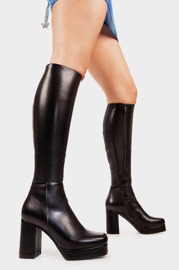 Elegant Entrancers
 
 Humble Platform Knee High Boots in Black faux leather. These black Platform Boots feature on our platform sole with gusset detail to the back of the boot, perfect for any occasion. Made with eco-friendly materials and 100% cruelty-free, these platform boots are as ethical as they are Elegant! 
 
 - Platform Height: 1.6 inch
 - Heel Height: 5.5 inch
 - Gusset detail
 - Black zip
 - Wide ankle and calf friendly
 - Platform sole
 - Square Toe 
 - 100% vegan 
 
 SKU: LMF 2179 - BlackPU