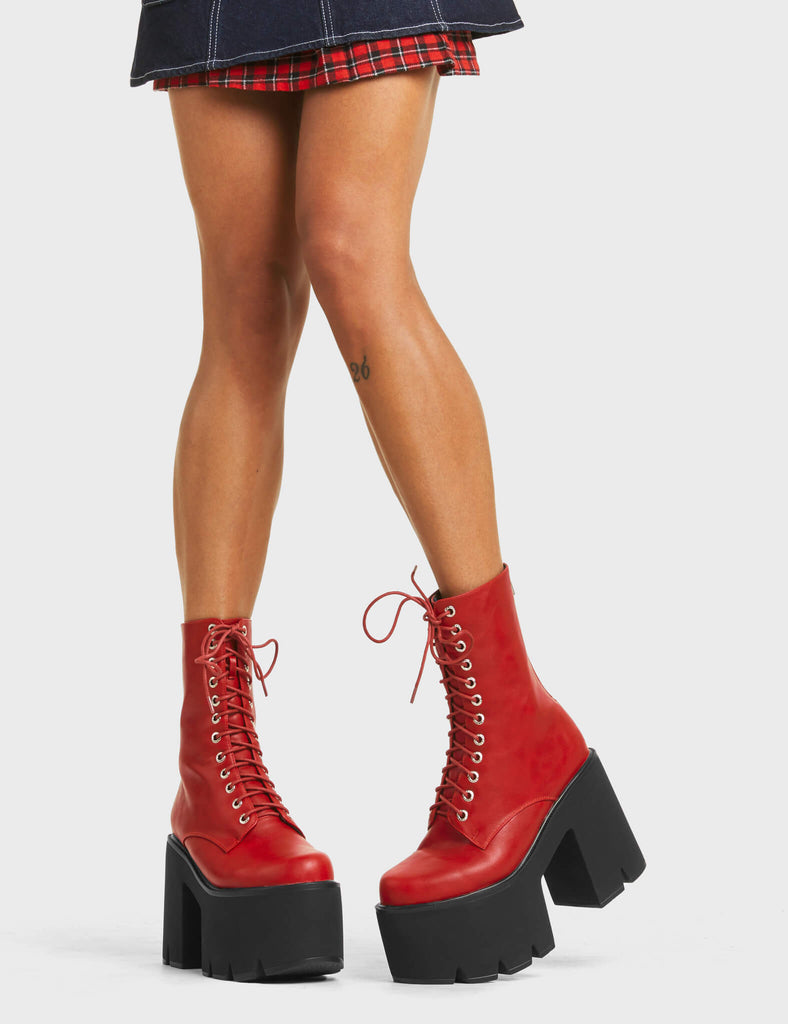 A WONDER
  
  Iconic Chunky Platform Ankle Boots in Dark Red faux leather. These platform boots feature a lace-up design with a functional back zip, the perfect way to elevate any outfit. Made with eco-friendly materials and 100% cruelty-free, these platform boots are as ethical as they are eye-catching.
  
  - Platform Height
  - Heel Height
  - Lace Up
  - Silver Eyelets
  - Back Zip
  - Chunky Platform Sole
  - 100% vegan
  
  SKU: LMF 5015 - DarkRedPU