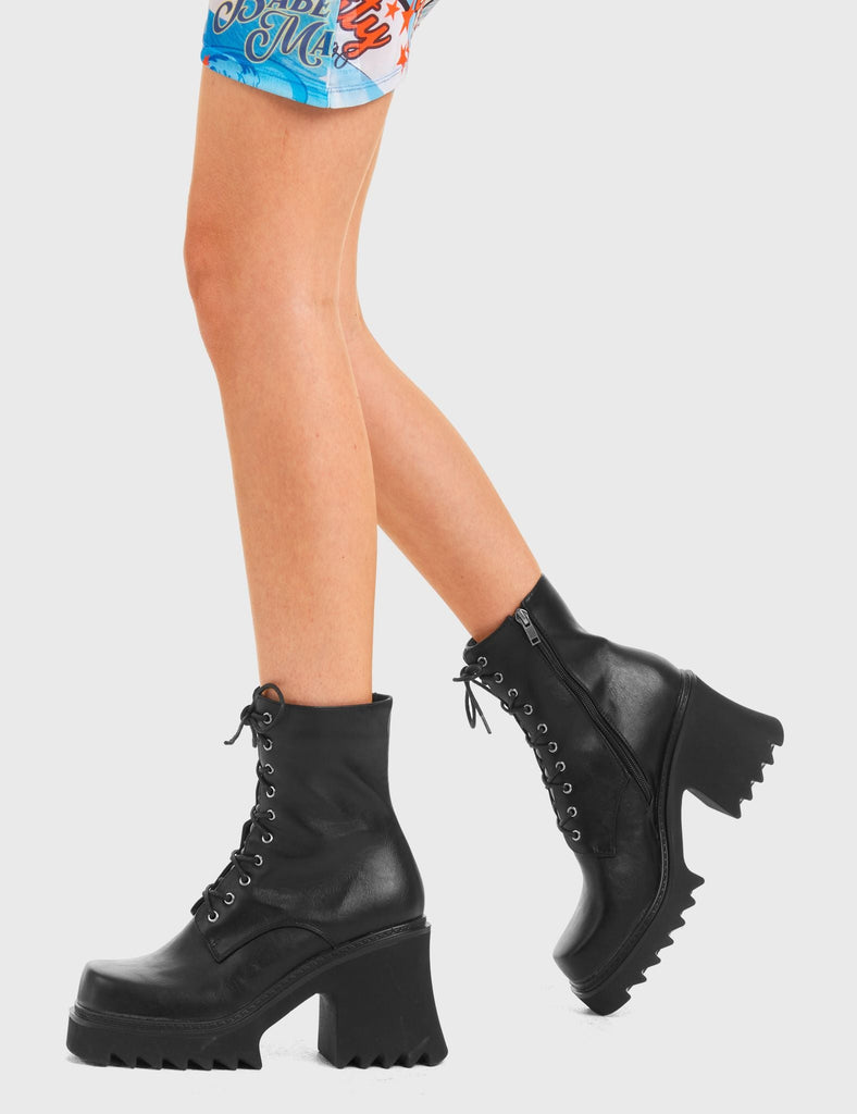 ON A HIGH
  
  In Opposition Chunky Platform Ankle Boots in Black faux leather. These vegan western Boots feature black laces and a shark teeth grip sole, very chic. Made with eco-friendly materials and 100% cruelty-free, these boots are as ethical as they are edgy!
  
  
  - Chunky Platform
  - Calf length
  - Shark teeth grip
  - Black laces
  - Rounded toe 
  - 100% vegan 
  
  SKU: LMF 3729 - BlackPU