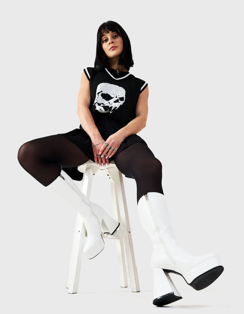 Obsessed
  
  Infatuation Platform Calf Boots in White faux leather. These white vegan Platform Boots feature on our platform sole, walking on platform dreams.Made with eco-friendly materials and 100% cruelty-free, these platform boots are as ethical as they are sexy.
  
  
  - Platform Height: 2.6 inch
  - Heel Height: 5.5 inch
  - Calf High length
  - White Zipper
  - Platform sole
  - Flared heel
  - Round Toe
  - 100% vegan 
  
  SKU: