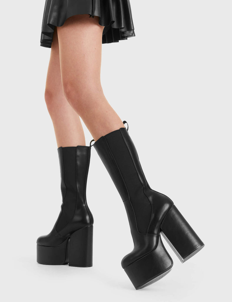 Not Your Basic Boots
  
  Intrusion Platform Calf Boots in Black faux leather. These platform boots feature a minimalist design, with a stetchy gusset and a pull tag, perfect with any outfit. Made with eco-friendly materials and 100% cruelty-free, these platform boots are as ethical as they are Perfect!
  
  - Platform Height
  - Heel Height
  - gusset and pull tag
  - calf length
  - Platform sole
  - High Heel
  - 100% vegan 
  
  SKU: LMF 2850 - BlackPU