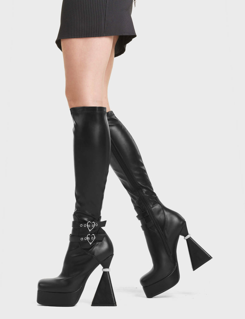 Love It Platform Knee High Boots in Black. Feature heart shaped buckles, on a platform sole with silver ring platform heel.