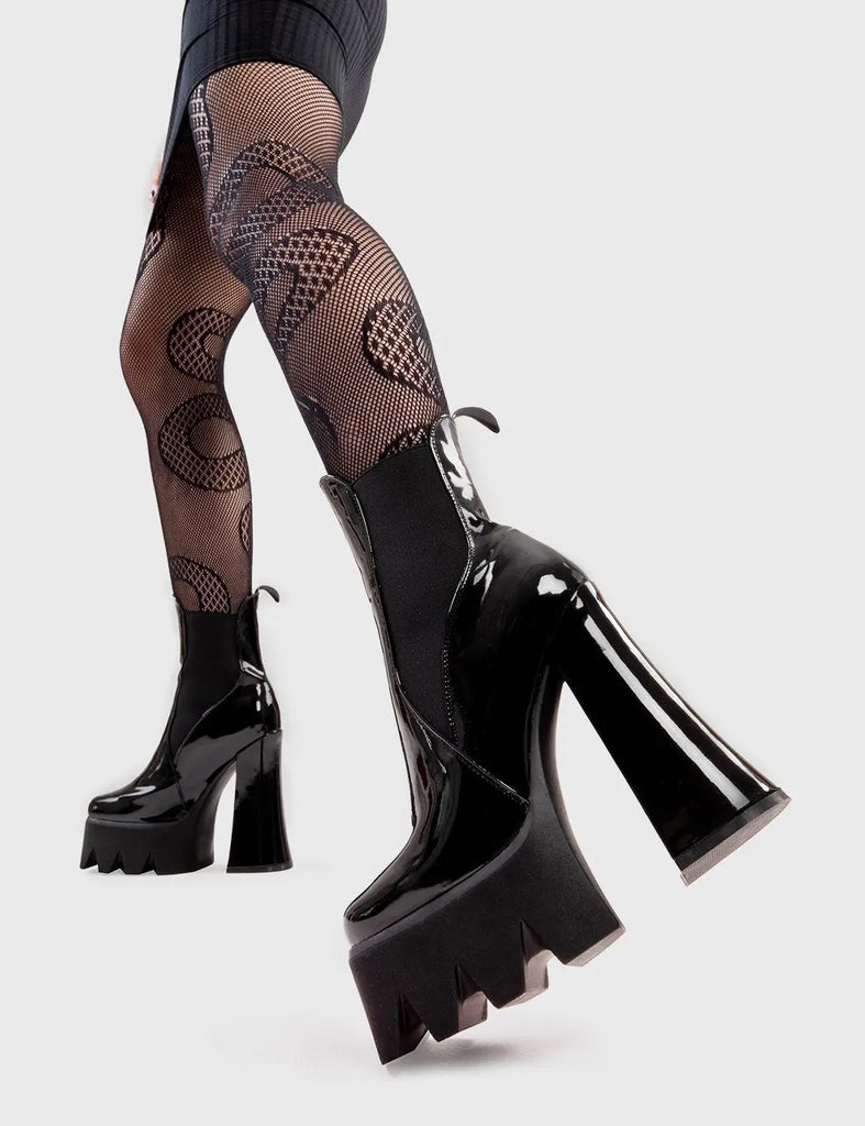 Trend Setter
  
  Lumiel Platform Ankle Boots in Black Patent. These platform boots feature a minimalist design with a gusset and pull tag. They are the perfect way to elevate any look. Made with eco-friendly materials and 100% cruelty-free, these platform boots are as ethical as they are Trendy.
  
  - Platform Height
  - Heel Height
  - Gusset and pull tag
  - Black Zip
  - High Heel
  - Platform Sole
  - 100% vegan 
  
  SKU: LMF 2973 - BlackPAT