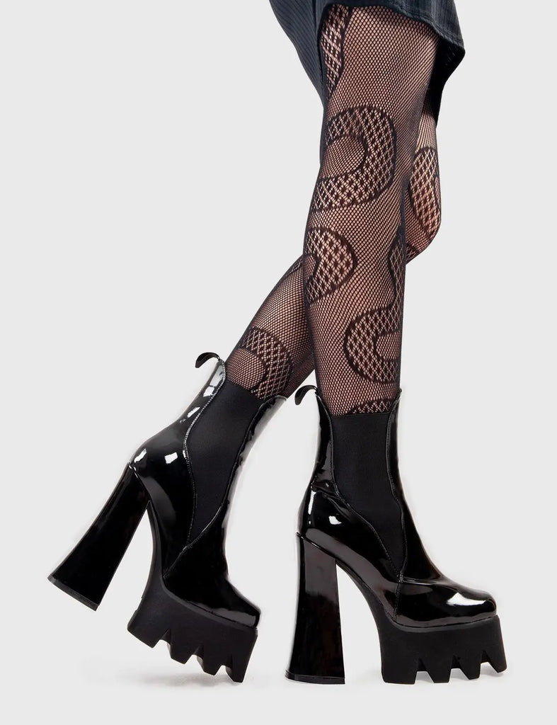 Trend Setter
  
  Lumiel Platform Ankle Boots in Black Patent. These platform boots feature a minimalist design with a gusset and pull tag. They are the perfect way to elevate any look. Made with eco-friendly materials and 100% cruelty-free, these platform boots are as ethical as they are Trendy.
  
  - Platform Height
  - Heel Height
  - Gusset and pull tag
  - Black Zip
  - High Heel
  - Platform Sole
  - 100% vegan 
  
  SKU: LMF 2973 - BlackPAT