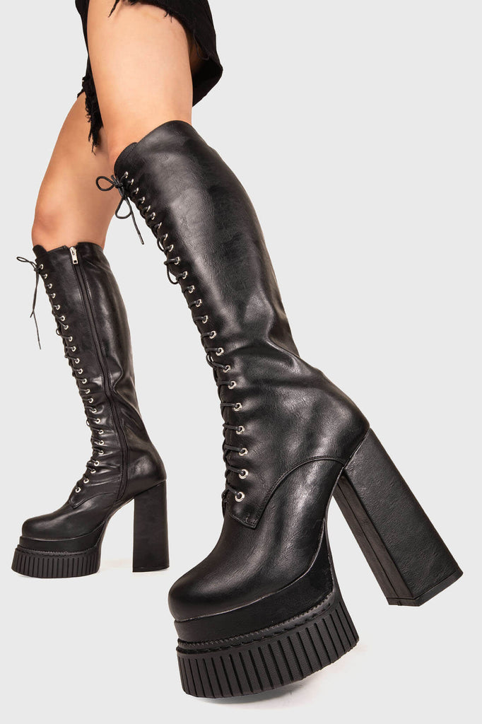 MAKE YOUR STATEMENT
 
 Moment Of Clarity Creeper Platform Knee High Boots in Black faux leather. These Black vegan Knee High Boots feature a Creeper Platform sole, perfect for adding height and the wow factor to any outfit. Made with eco-friendly materials and 100% cruelty-free, these boots are as ethical as they are slick!
 
 
 - Platform Height: 2 inch
 - Heel Height: 5.5 inch
 - Knee high length
 - Black zipper 
 - Lace up
 - Platform creeper sole
 - Square toe 
 - 100% vegan 
 
 SKU: LMF 1236 - BlackPU