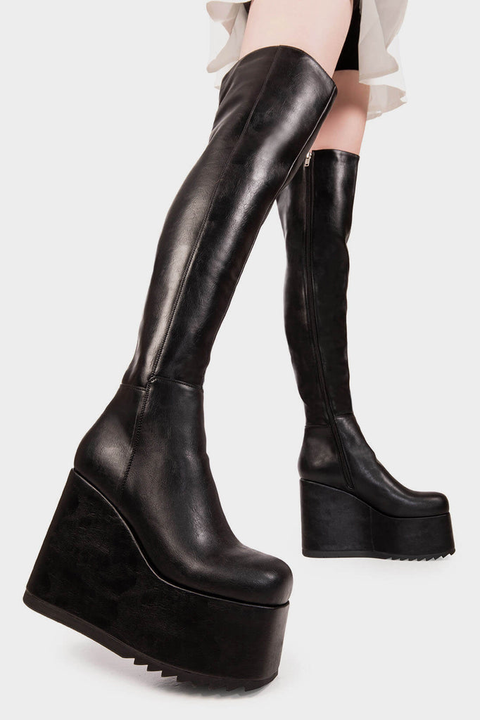 Peak Perfection
  
  Never Again Chunky Platform Thigh High Boot in Black faux leather. These black vegan Platform Boots feature on our chunky platform wedge sole, let the boots do the talking. Made with eco-friendly materials and 100% cruelty-free, these platform boots are as ethical as they are Perfect!
  
  
  - Platform Height
  - Black Zipper
  - Chunky Platform wedge sole
  - Shark's teeth grip
  - Round Toe
  - 100% vegan 
  
  SKU: LMF 2069 - BlackPU