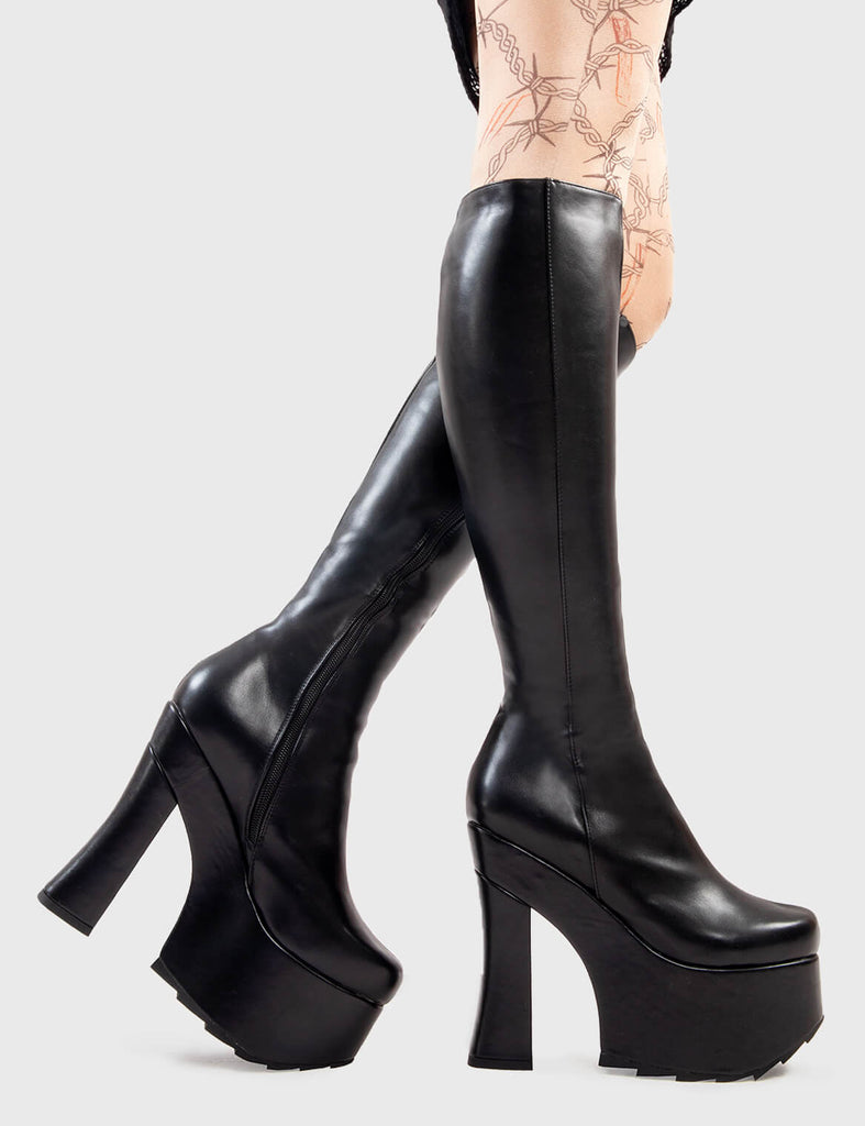 Not Your Basic Boots
  
  Night Vision Platform Knee High Boots in Black faux leather. These platform boots feature a minimalist design withj a curved heel, the perfect way to elevate any look. Made with eco-friendly materials and 100% cruelty-free, these platform boots are as ethical as they are cool.
  
  - Platform Height
  - Heel Height
  - Curved Heel
  - Black Zip
  - Shark's teeth grip
  - Chunky Platform sole
  - 100% vegan 
  
  SKU: LMF 2926 - BlackPU