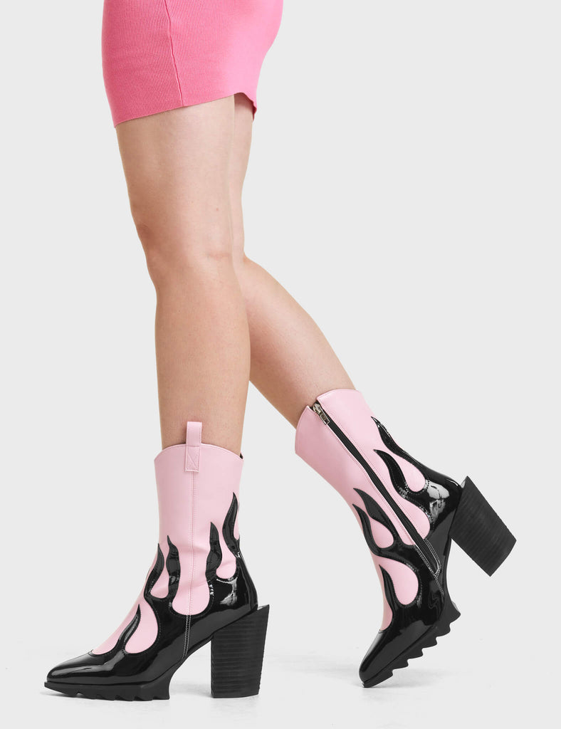 On Fire Western Ankle Boots. These pink Ankle Boots feature a black flame design, and a signature western block heel. 
