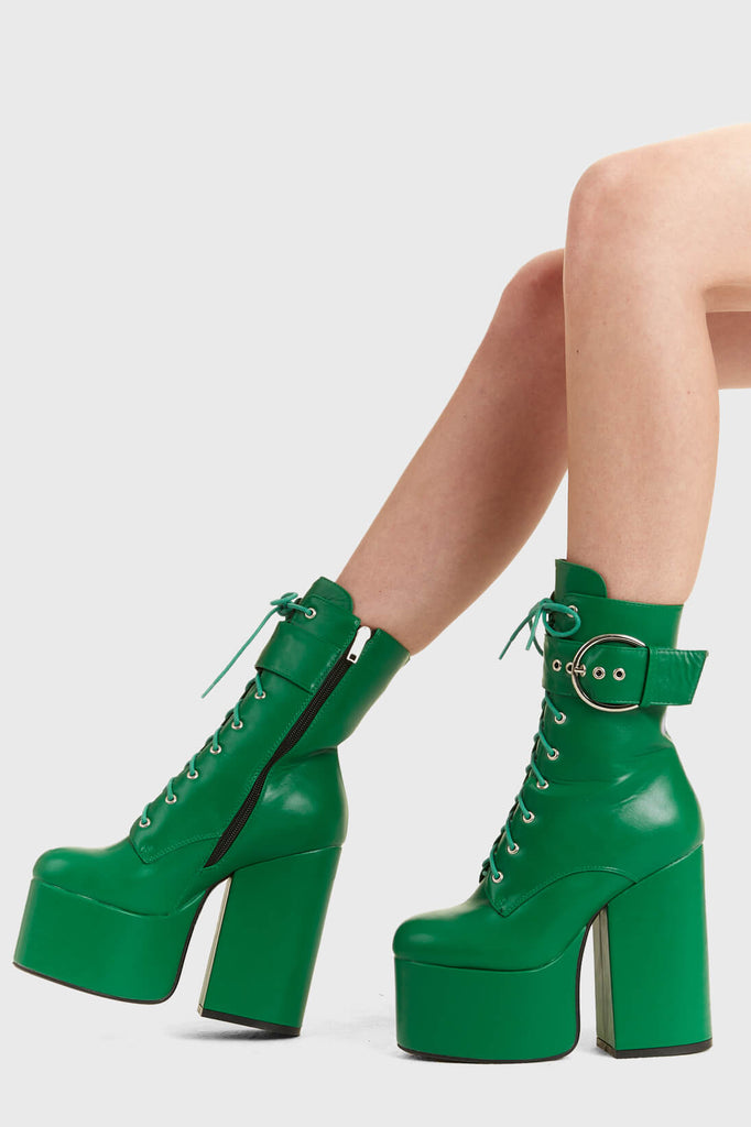 Not Your Basic Boots

One Shot Platform Ankle Boots in Green faux leather. These platform boots feature a lace-up design, with a thick strap around the angle with a silver buckle, perfect to elevate any outfit. Made with eco-friendly materials and 100% cruelty-free, these platform boots are as ethical as they are Perfect!

- Platform Height
- Heel Height
- Green Zipper
- lace-up
- Strap around ankle
- silver buckle and eyelets
- Ankle length
- Platform sole
- High Heel
- 100% vegan 

SKU: LMF 2848 - GreenPU