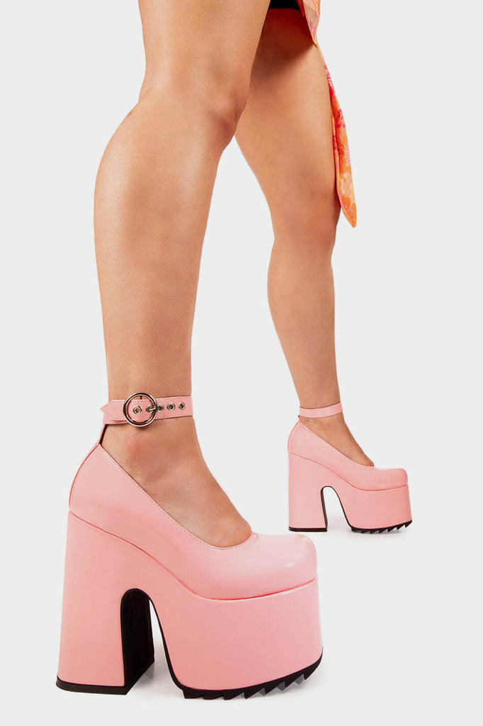 Boss Babe
 
 Power Trip Chunky Platform Heels in Pink Patent faux leather. These pink Platform Heels feature on our platform sole with an adjustable ankle strap and 'O' ring buckles and silver eyelets, make a powerful statment with each stomp. Made with eco-friendly materials and 100% cruelty-free, these platform boots are as ethical as they are Bossy! 
 
 - Platform Height
 - Heel Height
 - Adjustable straps with silver eyelets
 - 'O'ring shaped buckles
 - Platform sole
 - Square Toe 
 - 100% vegan
