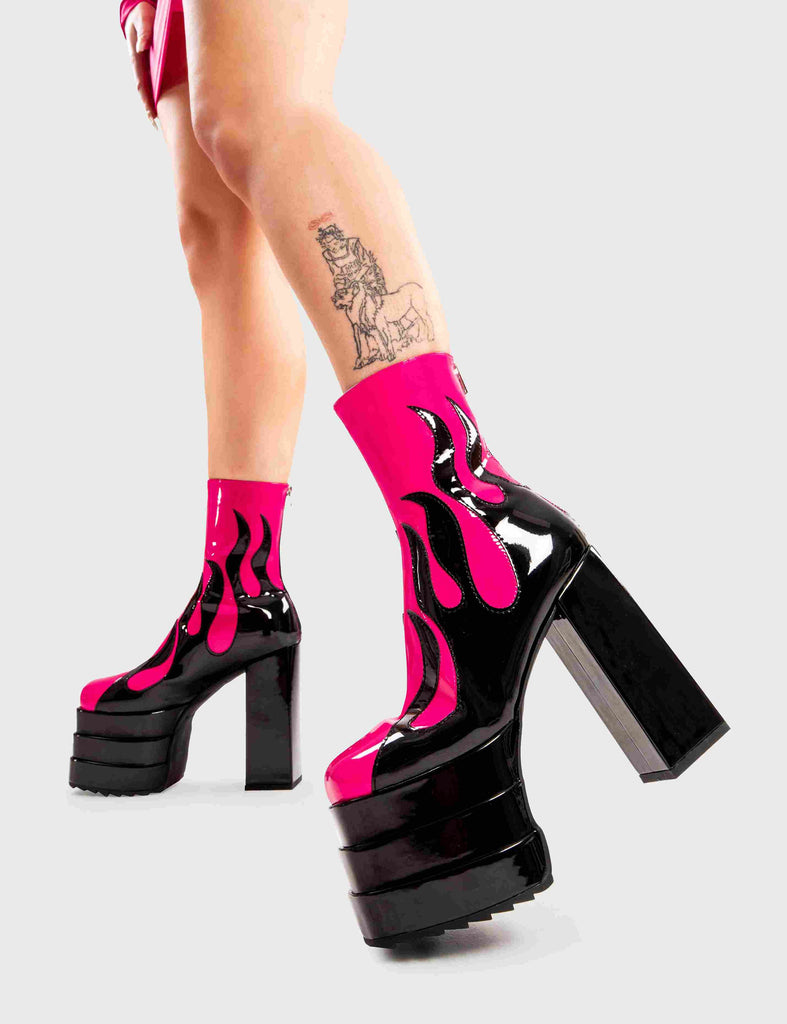 Set Things on Fire
  
  Reborn Platform Ankle Boots in Fuchsia faux leather. These platform boots feature a black flame design on our triple stack platform sole. Made with eco-friendly materials and 100% cruelty-free, these platform boots are as ethical as they are Fire.
  
  - Platform Height
  - Heel Height
  - Black zip
  - Flame design
  - High Heel
  - Triple Stack platform sole
  - 100% vegan 
  
  SKU: LMF 2998 - FuchsiaPU/Flame