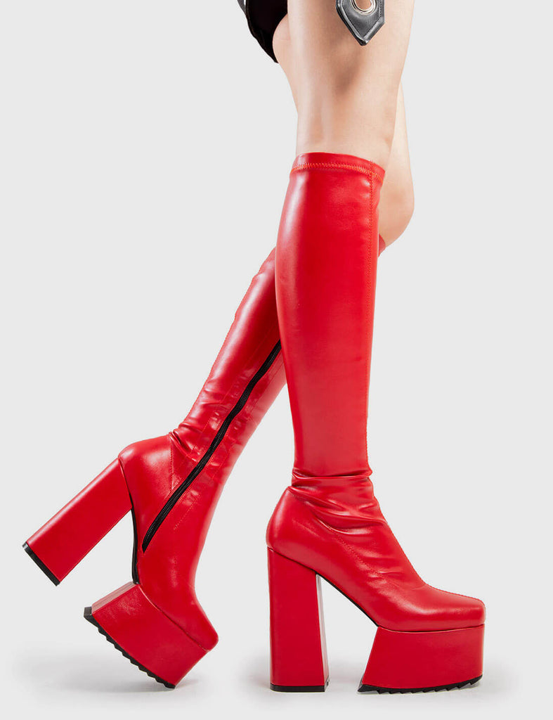 Not Your Basic Boots
  
  Return The Favour Platform Knee High Boots in Red faux leather. These platform boots feature a minimalist design, with a stretchy fitted feel, the perfect pair with any outfit. Made with eco-friendly materials and 100% cruelty-free, these platform boots are as ethical as they are Cool!
  
  - Platform Height
  - Heel Height
  - Black Zipper
  - Fitted feel
  - Knee length
  - Platform sole
  - Shark's teeth grip
  - High Heel
  - 100% vegan 
  
  SKU: LMF 2875 - RedPU