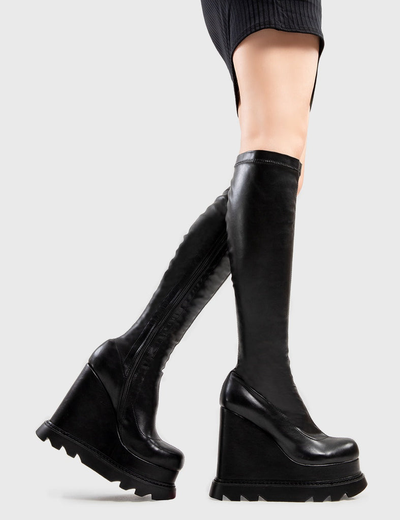 Being Badass
  
  Roses Chunky Platform Calf Boots in Black faux leather. These Black vegan Wedge boots feature a minimalist design with our Platform wedge sole, perfect for adding height and style to any look. Made with eco-friendly materials and 100% cruelty-free, these boots are as ethical as they are badass!
  
  
  - Platform Height: 
  - Heel Height
  - Black Zip
  - Wedge sole
  - Round Toe
  - 100% vegan 
  
  SKU: LMF 2947 - BlackPU