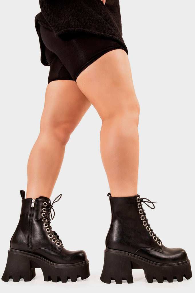 TAKE ON THE WORLD
  
  Run To You Chunky Platform Ankle Boots in Black Patent. These vegan Boots feature a CHUNKY Platform sole and large O shaped eyelets, perfect for adding height and edge to any outfit. Made with eco-friendly materials and 100% cruelty-free, these Boots are as ethical as they are hot!
  
  
  - Platform Height: 3.3 inch
  - Black zipper
  - Lace up
  - O shaped buckle and silver eyelets
  - CHUNKY Platform sole
  - Square toe 
  - 100% vegan 
  
  SKU: LMF 1370 - BlackPU