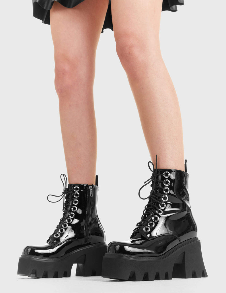 TAKE ON THE WORLD
  
  Run To You Chunky Platform Ankle Boots in Black Patent. These vegan Boots feature a CHUNKY Platform sole and large O shaped eyelets, perfect for adding height and edge to any outfit. Made with eco-friendly materials and 100% cruelty-free, these Boots are as ethical as they are hot!
  
  
  - Platform Height: 3.3 inch
  - Black zipper
  - Lace up
  - O shaped buckle and silver eyelets
  - CHUNKY Platform sole
  - Square toe 
  - 100% vegan 
  
  SKU: LMF 1370 - BlackPAT