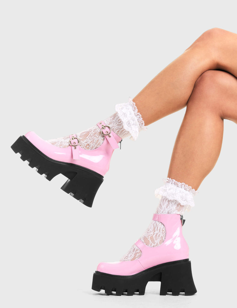 BUCKLED UP
  
  Slow Jamz Chunky Platform Ankle Boots in pink patent. These platform boots feature two adjustable starps with silver buckles and eyelets. Made with eco-friendly materials and 100% cruelty-free, these platform boots are as ethical as they are chic.
  
  - Platform Height
  - Ankle length
  - Two adjustable straps
  - Silver buckles and eyelets
  - Rounded toe
  - High Heel
  - 100% vegan 
  
  SKU: LMF 3600 - PinkPAT