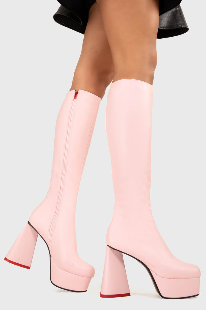 LOVEABLE 
  
  Sweet Talker Platform Knee High Boots in Pink faux leather. These platform boots feature a minimalist look with a heart shaped heel, keeping it nice and classy. Made with eco-friendly materials and 100% cruelty-free, these platform boots are as ethical as they are chic.
  
  - Platform Height
  - Knee length
  - Heart shaped heel
  - Red sole
  - Pink zip
  - High Heel
  - 100% vegan 
  
  SKU: LMF 3313 - PinkPU