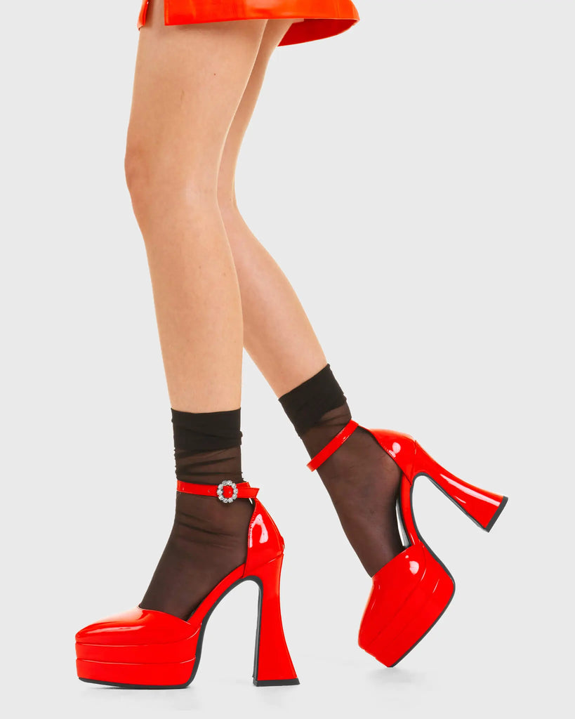 CATWALK READY
  
  Tear of Joy Platform Heels in Red patent. These platform boots feature a minimalist look with a flared heel, keeping it nice and classy. Made with eco-friendly materials and 100% cruelty-free, these platform boots are as ethical as they are chic.
  
  - Platform Height
  - Adjustable strap
  - Flared heel
  - Pointed toe
  - High Heel
  - 100% vegan 
  
  SKU: LMF 3525 - RedPAT