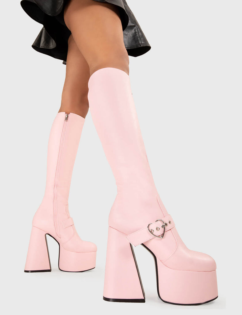 YOU STOLE MY HEART
  
  Walk With Love Platform Knee High Boots in Pink faux leather. These platform boots feature a minimalist look with a Flared heel, and an adjustable strap. Made with eco-friendly materials and 100% cruelty-free, these platform boots are as ethical as they are chic.
  
  - Platform Height
  - Knee high 
  - Silver heart buckle
  - Flared heel
  - High Heel
  - 100% vegan 
  
  SKU: LMF 3358 - PinkPU