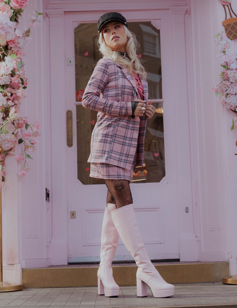 THE TIMELESS ONE
  
  Whatta Showdown Platform Knee High Boots in Pink faux leather. These Pink vegan Boots feature an elegant, minimalist design and a Platform sole and heel, perfect for adding height and style to any outfit. Made with eco-friendly materials and 100% cruelty-free, these boots are as ethical as they are stylish.
  
  
  - Platform Height: 1.25 inch
  - Heel Height: 4.2 inch
  - Knee High length
  - Pink zipper 
  - Platform sole
  - Round toe 
  - 100% vegan 
  
  SKU: LMF 0916 - PinkPU