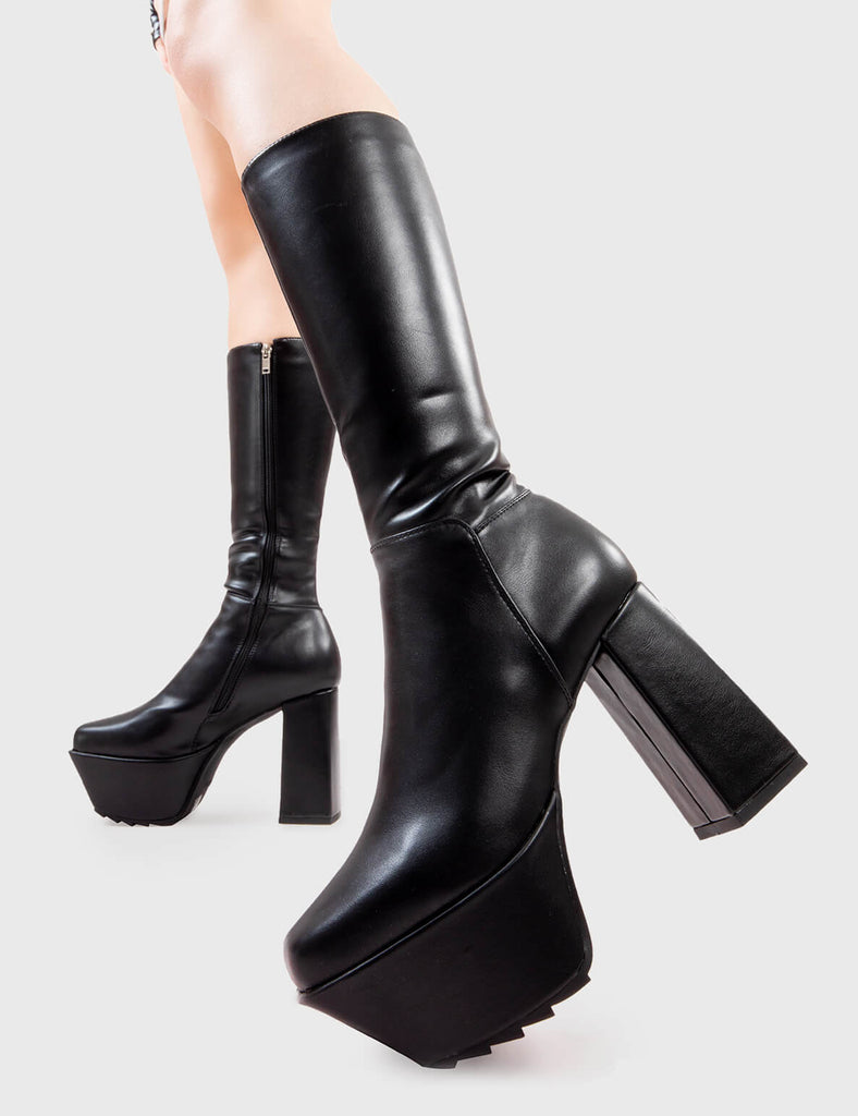 Next Level
  
  Who Cares Platform Calf Boots in Black faux leather. These platform boots feature on a chunky platform sole, leave them with a lasting impression.Made with eco-friendly materials and 100% cruelty-free, these platform boots are as ethical as they are Next Level.
  
  - Platform Height
  - Heel Height
  - Black Zipper
  - Calf length
  - Chunky Platform sole
  - Shark's teeth grip
  - Square Toe 
  - 100% vegan 
  
  SKU: LMF 2824 - BlackPU